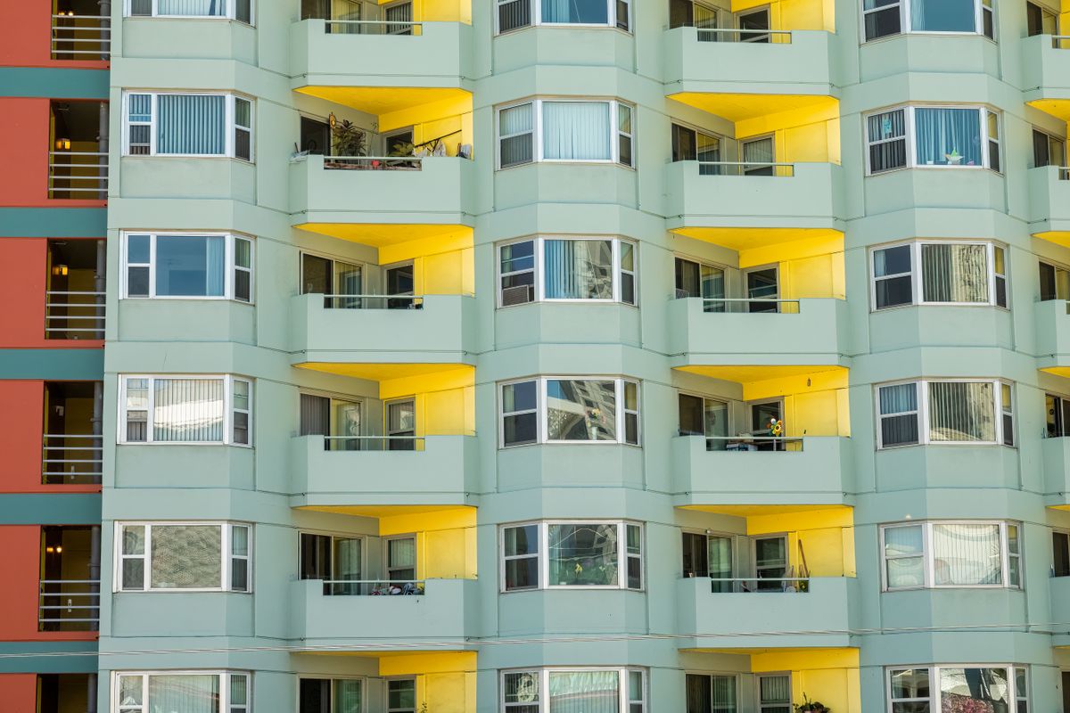 Modern apartment building facade in warm sunlight showcasing geometric patterns in San Francisco.